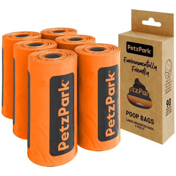 Orange rolls of Petz Park poop bags for dogs with a cardboard box packaging on a white background